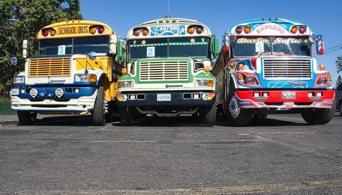 Guatemalan economy / Chicken buses / Photo by Alexander Schimmeck on Unsplash